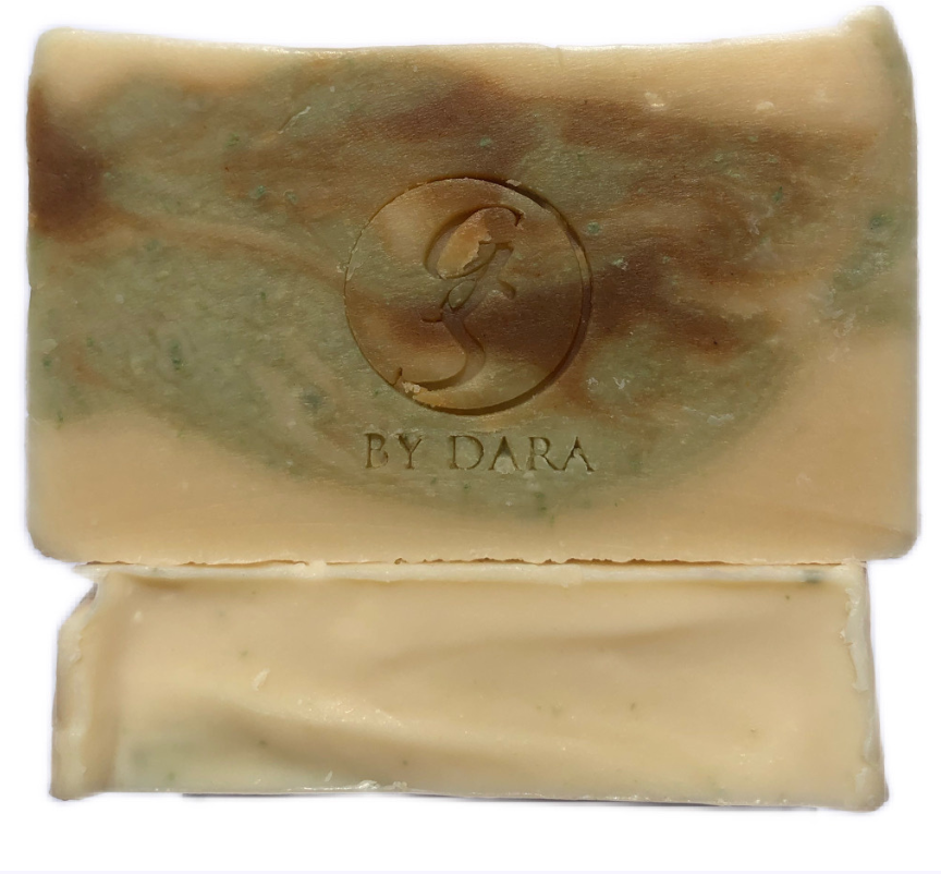 Green Smoothie soap: Milky cream coloured soap with a green and brown swirl and brand logo stamped on the center. Made with coconut milk base, aloe vera, cucumber, French green clay and turmeric